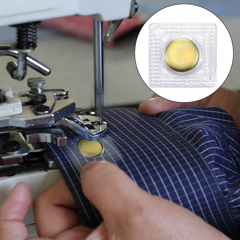 Sew-in and adhesive magnetic buttons compared on garment fabric