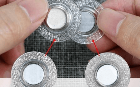 Structure of encapsulated magnetic clothing fastener, neodymium magnet core with protective housing